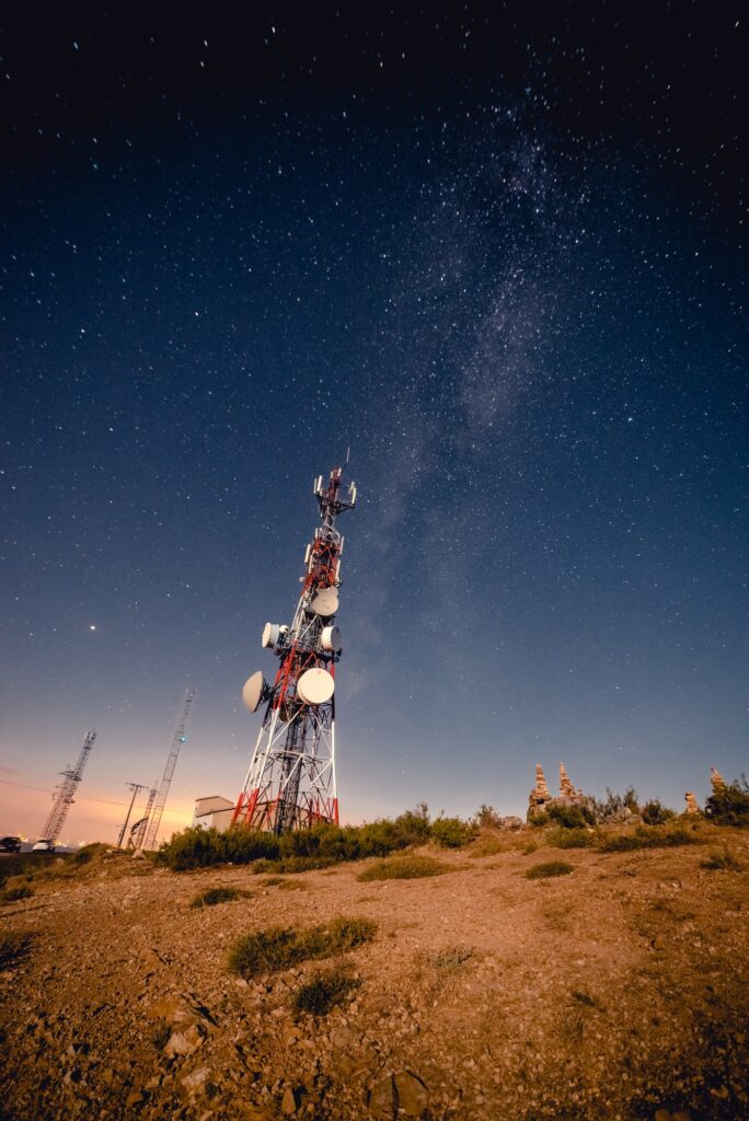 Communication tower and sky with stars in evening
